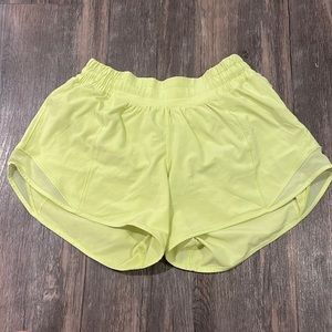Size 4 Yellow Hotty Hot Lulu Lemon shorts 4 inch. Worn once. Perfect condition.